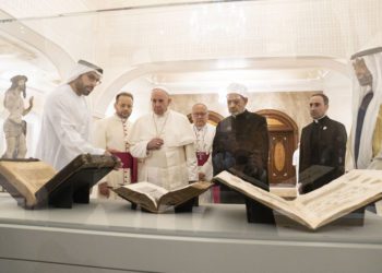 ABU DHABI, UNITED ARAB EMIRATES - February 4, 2019: Day two of the UAE papal visit -  His Holiness Pope Francis, Head of the Catholic Church (centre L), and His Eminence Dr Ahmad Al Tayyeb, Grand Imam of the Al Azhar Al Sharif (centre R), look at versions of the Quran, Bible and Torah on loan from the Louvre Abu Dhabi. Seen with HE Mohamed Khalifa Al Mubarak, Chairman of the Department of Culture and Tourism and Abu Dhabi Executive Council Member (L), and HH Sheikh Mohamed bin Zayed Al Nahyan, Crown Prince of Abu Dhabi and Deputy Supreme Commander of the UAE Armed Forces (R), during a dinner reception at Al Mushrif Palace. 
( Ryan Carter / Ministry of Presidential Affairs )
---