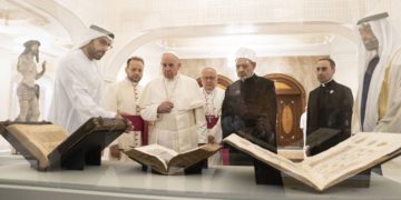 ABU DHABI, UNITED ARAB EMIRATES - February 4, 2019: Day two of the UAE papal visit -  His Holiness Pope Francis, Head of the Catholic Church (centre L), and His Eminence Dr Ahmad Al Tayyeb, Grand Imam of the Al Azhar Al Sharif (centre R), look at versions of the Quran, Bible and Torah on loan from the Louvre Abu Dhabi. Seen with HE Mohamed Khalifa Al Mubarak, Chairman of the Department of Culture and Tourism and Abu Dhabi Executive Council Member (L), and HH Sheikh Mohamed bin Zayed Al Nahyan, Crown Prince of Abu Dhabi and Deputy Supreme Commander of the UAE Armed Forces (R), during a dinner reception at Al Mushrif Palace. 
( Ryan Carter / Ministry of Presidential Affairs )
---