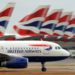 A British Airways aircraft taxis past other parked British Airways aircraft at Terminal 5 of Heathrow Airport in west London, on July 30, 2010.   British Airways said on Friday its net losses widened to 122 million pounds in its first quarter as strike action and the volcanic ash cloud grounded flights but insisted it was set to break even.    BA, which is looking to merge with Spain's Iberia, said losses after tax rose 15 percent to the equivalent of 146 million euros or 191 million dollars in the three months to June compared with a year earlier.      AFP PHOTO/ BEN STANSALL (Photo credit should read BEN STANSALL/AFP/Getty Images)