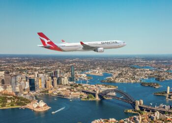 Aerial view of Sydney Harbour featuring the Sydney Opera House and Sydney Harbour Bridge.