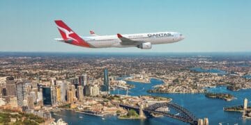 Aerial view of Sydney Harbour featuring the Sydney Opera House and Sydney Harbour Bridge.