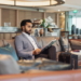 Business travel - Indian businessman waiting in an airport lounge